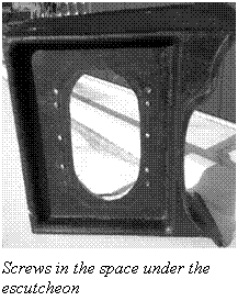 Text Box:  Screws in the space under the escutcheon